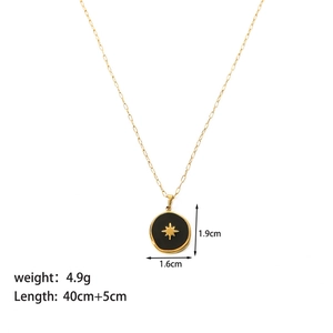 Detail view of hexagram coin pendant measuring 1.6cm by 1.9cm on a gold link chain