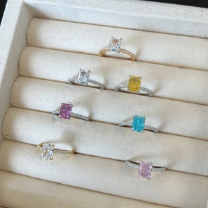 Close-up of S925 sterling silver rings with colorful ice flower cut zircon stones in a box