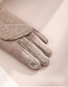 Detailed view of camel winter knit gloves with specialized touchscreen finger tips