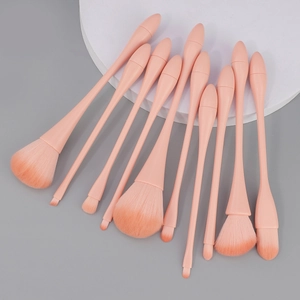 10-piece professional makeup brush set with pink gradient bristles and ergonomic handles