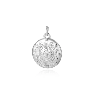 Detailed view of round silver sun face pendant with embossed rays and jump ring