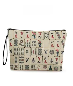 Close-up of the mahjong pattern texture and stitching on the canvas makeup bag
