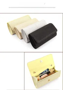Internal details of glitter envelope evening clutch showing four colors and capacity