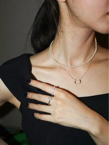 925 silver layered necklace set with pearls and moon pendant on model in black dress