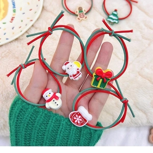 Christmas hair ties set with Santa and reindeer charms on red and green elastic ropes