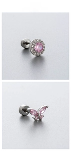 Macro detail of pink zircon butterfly and halo stud earrings with flat screw backs