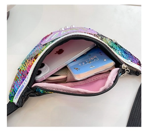 Close-up of rainbow sequin bag interior showing storage space for phone and notebook