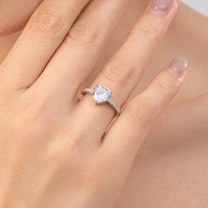 Elegant S925 sterling silver heart ring with sparkling diamonds worn on a finger