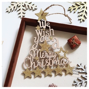 Detail showing wooden Merry Christmas ornament with gold stars and jute rope hanger