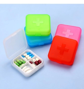 Top view of five colorful portable medicine cases with 4-compartment cross dividers