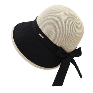 Elegant straw sun hat with black bow and LUCKY metal plate for summer beach vacation