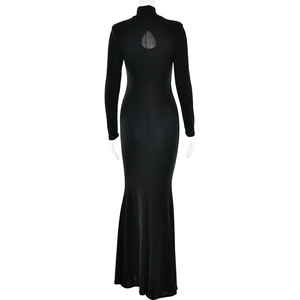 Detail of elegant black turtleneck maxi dress featuring a teardrop cutout on the back