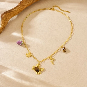 Gold stainless steel necklace with charms like mushroom, crab, maple leaf and rose