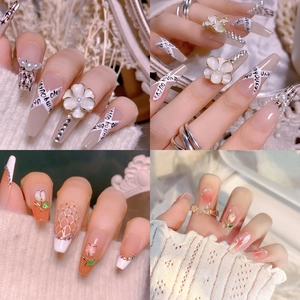 Artistic nail charms featuring tulip and camellia designs with 3D pearl and gold accents