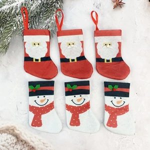 Set of 6 mini Christmas stockings featuring Santa and snowman patterns for holiday decor