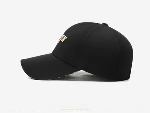 Side view of black cotton baseball cap with gold ICON embroidery and SPORT text on the brim
