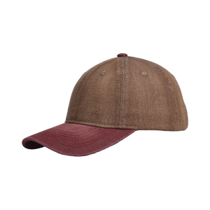 Detail of washed denim baseball cap featuring brown crown and burgundy brim stitching