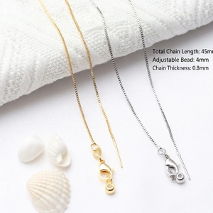 Adjustable 45mm copper cross chain in gold and silver finish with lobster clasp and bead