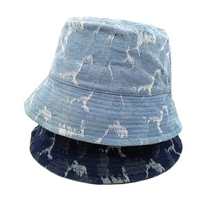 Vintage washed denim bucket hat set featuring white giraffe patterns in blue and light blue