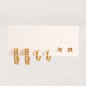 Detailed view of gold plated stainless steel earring set with rhinestones and star studs