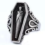 Detailed view of vintage gothic coffin ring featuring a miniature skull relief in antique silver