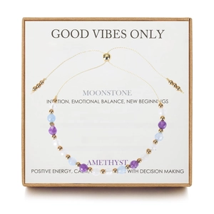 Detail of adjustable natural stone crystal bracelet in a kraft gift box with meaning card