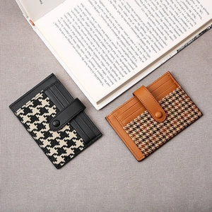 Slim houndstick leather card holder with snap closure and multi-slot design for women