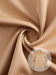 Close-up of khaki breathable mesh fabric texture on men's long sleeve polo shirt