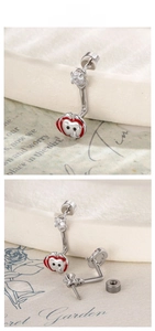 Detailed tile display of a red apple star stud earring with sparkling cubic zirconia stone