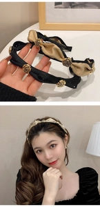 Detail showing black and beige camellia headbands with gold rose accents on model