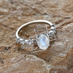 Vintage silver oval moonstone ring with sun and moon accents and 8x6mm center stone