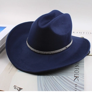 Detail of navy blue wool felt cowboy hat featuring a sparkling white rhinestone hatband