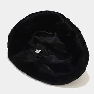 Detail view of the plush panda hat interior showing the black lining and care label