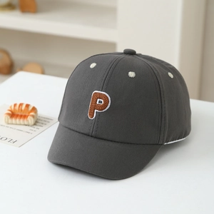 Detail of dark grey cotton baseball cap for kids with brown 3D embroidered P and white stars