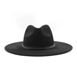 Close-up of black fedora hat featuring a leather band with decorative metal studs