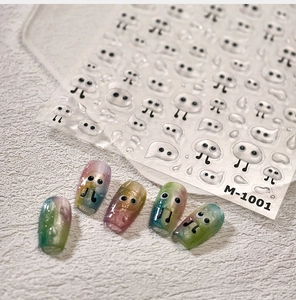 Macro detail of M-1001 3D water drop nail stickers with cute ghost designs