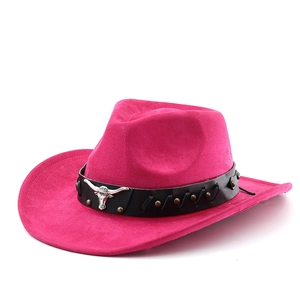Wide brim fuchsia suede cowboy hat with black leather band and silver bull head ornament