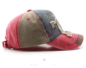 Detail of vintage washed cotton baseball cap featuring tri-color patchwork and 7 embroidery