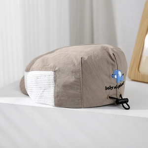 Detail of khaki baby elephant cap showing side breathable mesh and adjustable drawcord