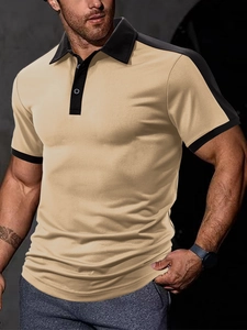 Detail of color-block knit polo shirt with black collar and beige twill fabric texture