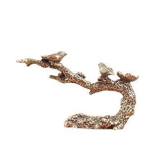 Support d'encens créatif en bronze avec deux oiseaux sur une branche en métal texturé