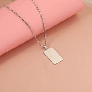 Polished stainless steel rectangular dog tag pendant on box chain close-up view