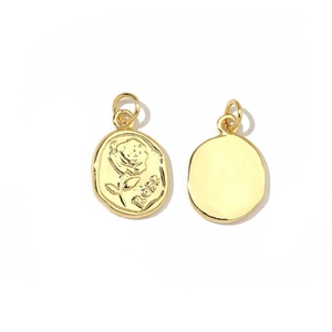 Detailed view of gold oval rose pendant charms showing embossed floral design and smooth back