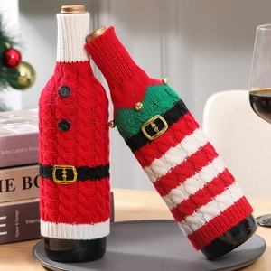 Close-up of knitted Santa and Elf wine bottle covers with stripe patterns and small bells