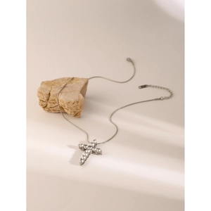 Silver stainless steel cross pendant necklace with white zircon on beige natural stone