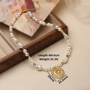Close-up of pearl necklace with gold spiral pendant featuring size 30mm and length details