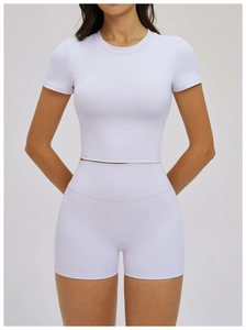 Detail of light purple slim fit yoga top and high waist shorts set for active sports
