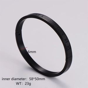 Detail view of black stainless steel punk bangle with engraved Roman numerals and dimensions