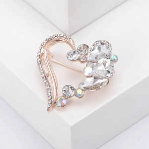 Detailed macro view of heart crystal brooch with rose gold plating and sparkling rhinestones
