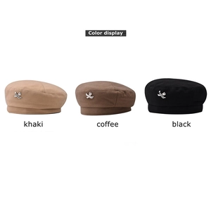 Wool beret in khaki, coffee, and black with metal crisscross detail for winter